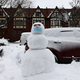 A snowman with a mask is seen in the Flatbush neighborhood of Brooklyn on February 02, 2021, in New York City. A nor’easter dumped up to 17 inches of snow in certain areas of NYC and blanketed parts of the Midwest and Mid-Atlantic with snow earlier this week.